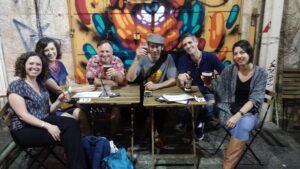 Friends drinking beer in the shuk